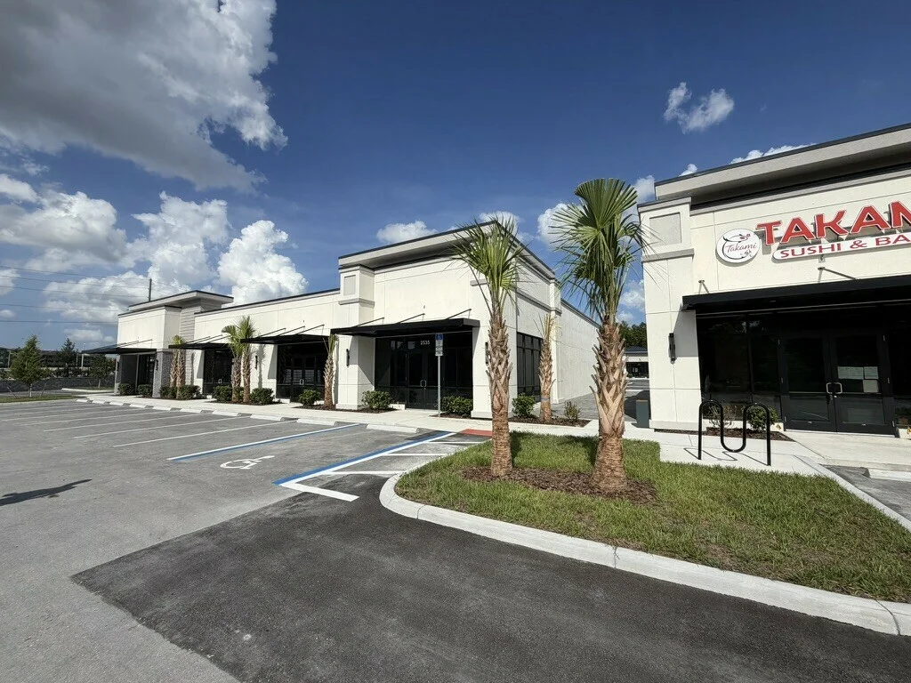 Lake Carter Exchange surrounding storefronts and parking; neighboring buildings shown for context